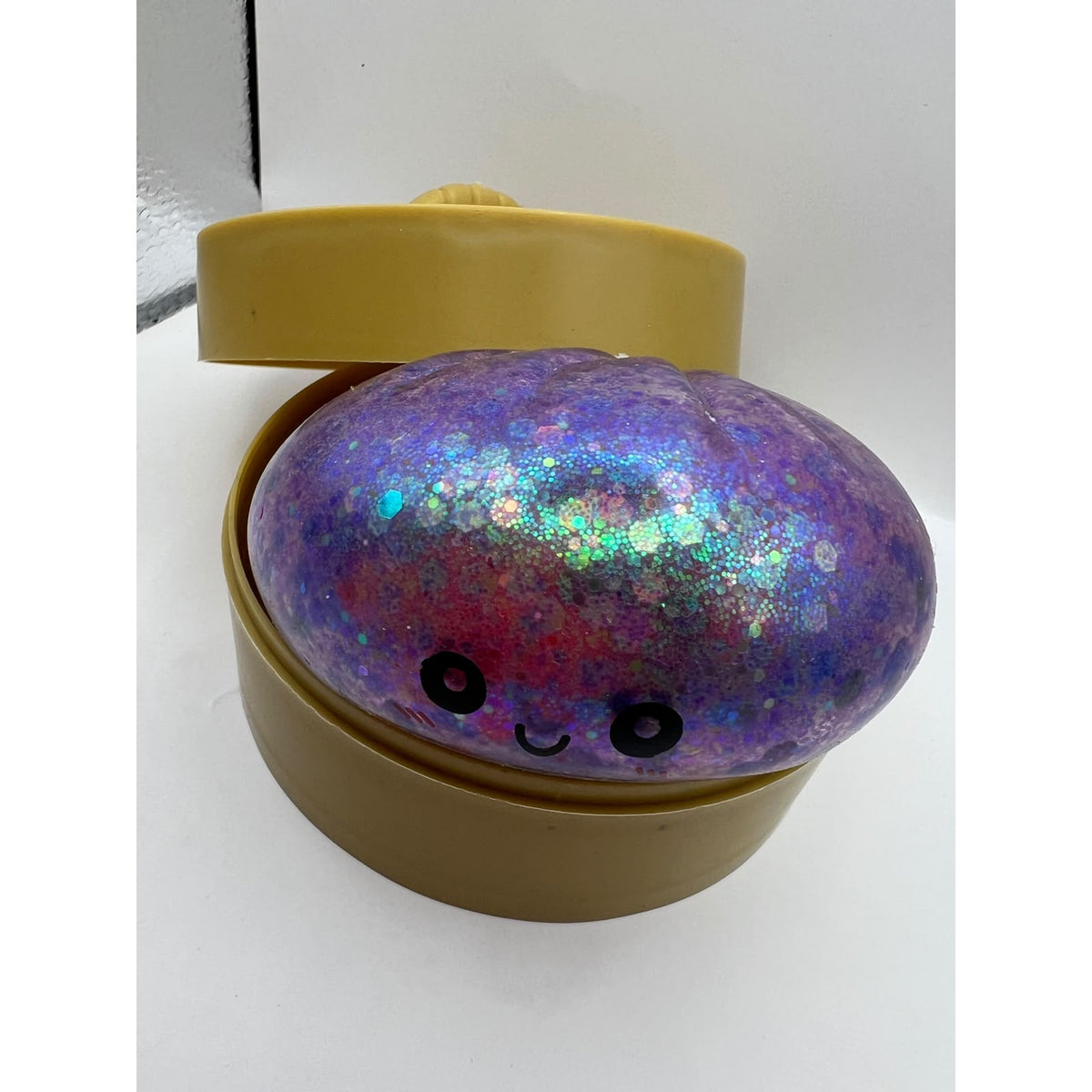 Squishy Bun Antiestrés color Glitter Morado — foto real del producto